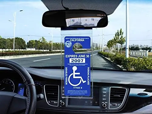 A transparent license plate holder with a hanging strap displaying an expired California plate.