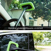 A long-handle windshield wiper tool is shown being used to clean a car window.
