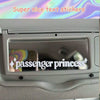 A close-up of a car interior showing a text sticker that reads passenger princess