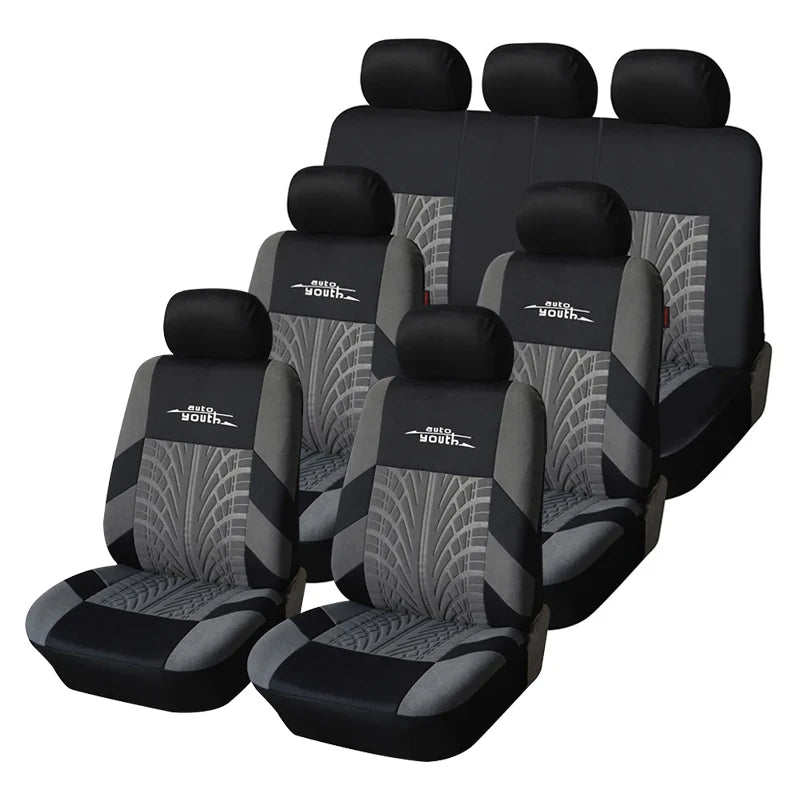 A set of black universal car seat covers with gray patterned fabric for multiple seats.