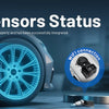 A blue professional OBD2 TPMS diagnostic scanner displaying sensor status on a vehicle wheel.