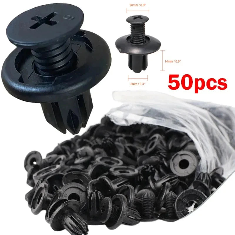 A pile of black plastic fasteners and screws for vehicle trim, including various sizes.