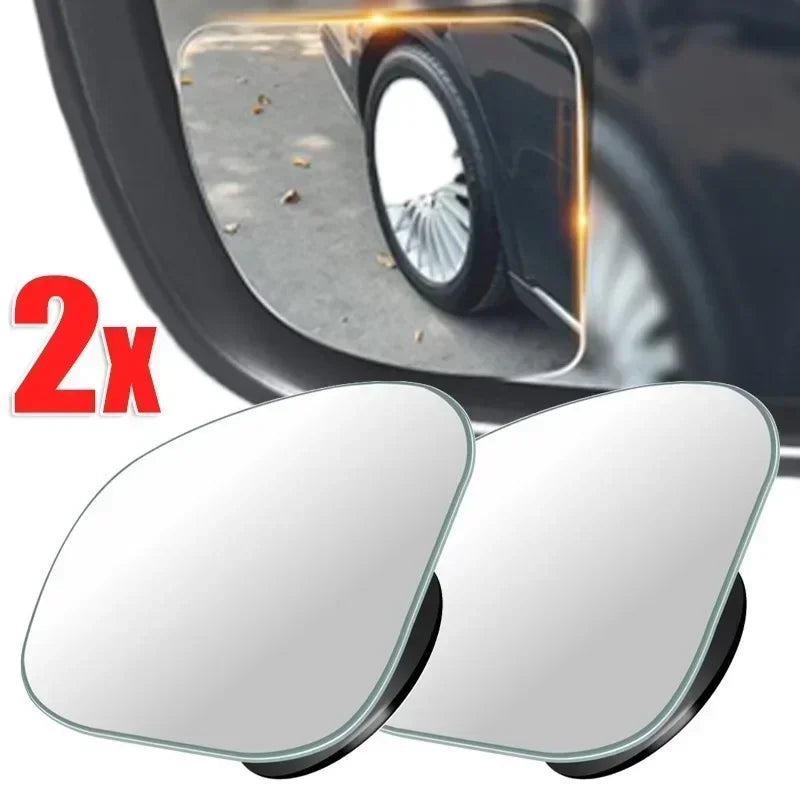 Two round, clear blind spot mirrors are shown next to a vehicle wheel.