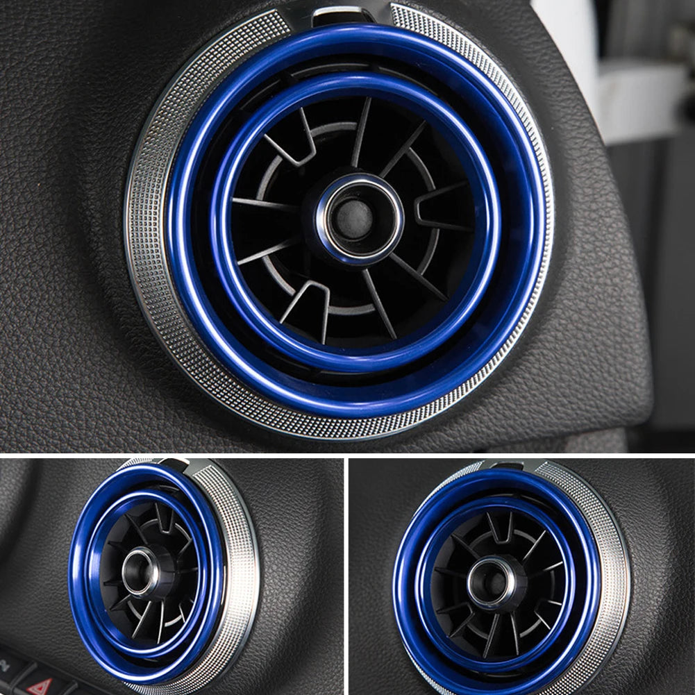 Close-up view of a black car interior air vent trim cover with a blue accent ring.