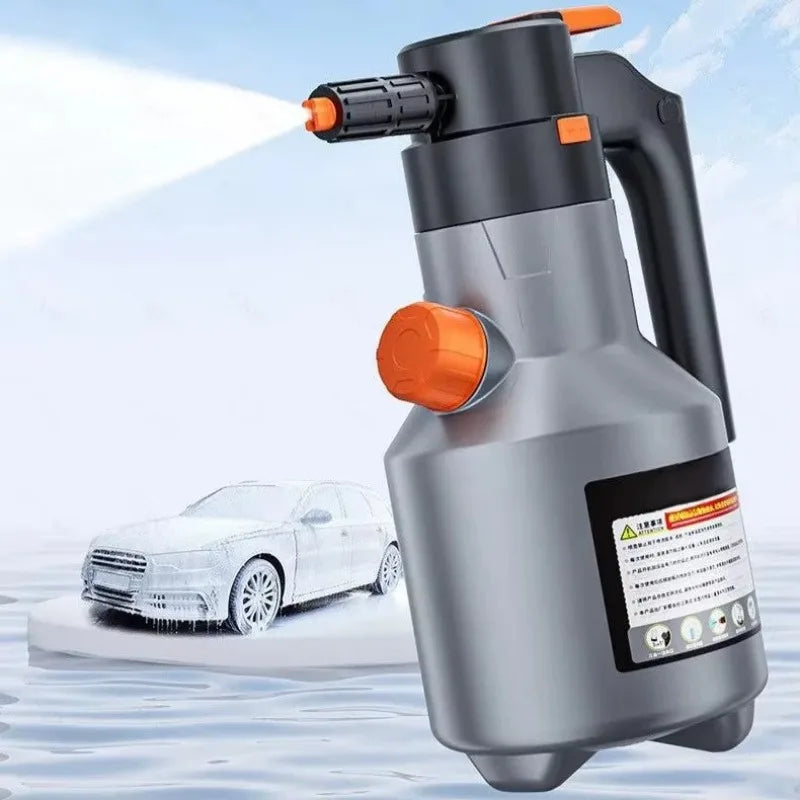 A silver electric foam sprayer is shown spraying water onto a white car in an outdoor setting.