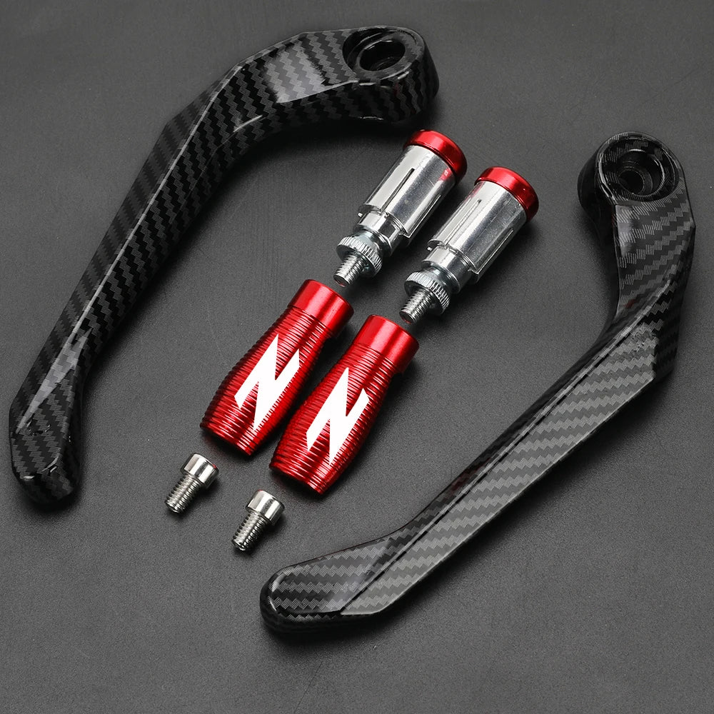A set of black carbon fiber motorcycle levers and handguard protectors with red accents.