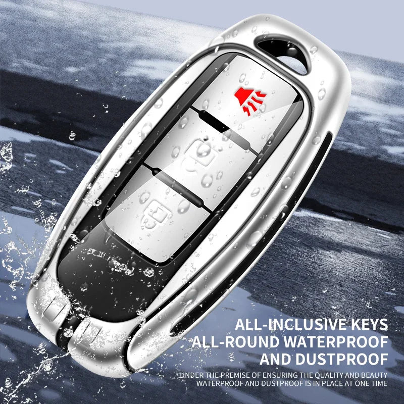 Silver key cover with a red logo and multiple keys shown under waterproof and dustproof conditions