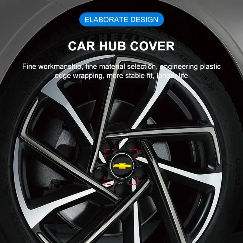 Close-up of a car wheel hub cover showing elaborate design and finished plastic edge wrapping.