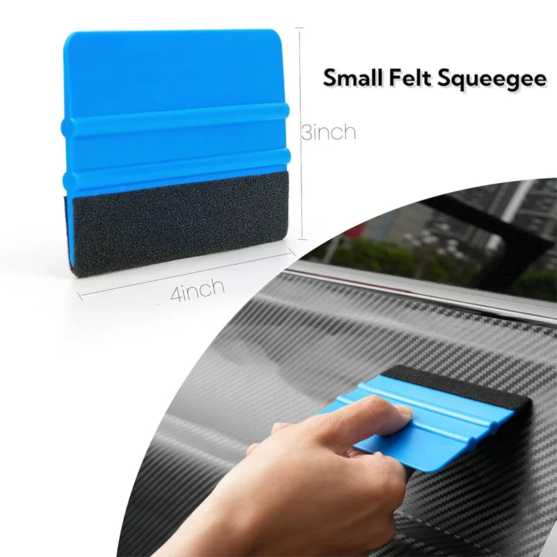 A hand is using a small blue felt squeegee to clean a window surface.