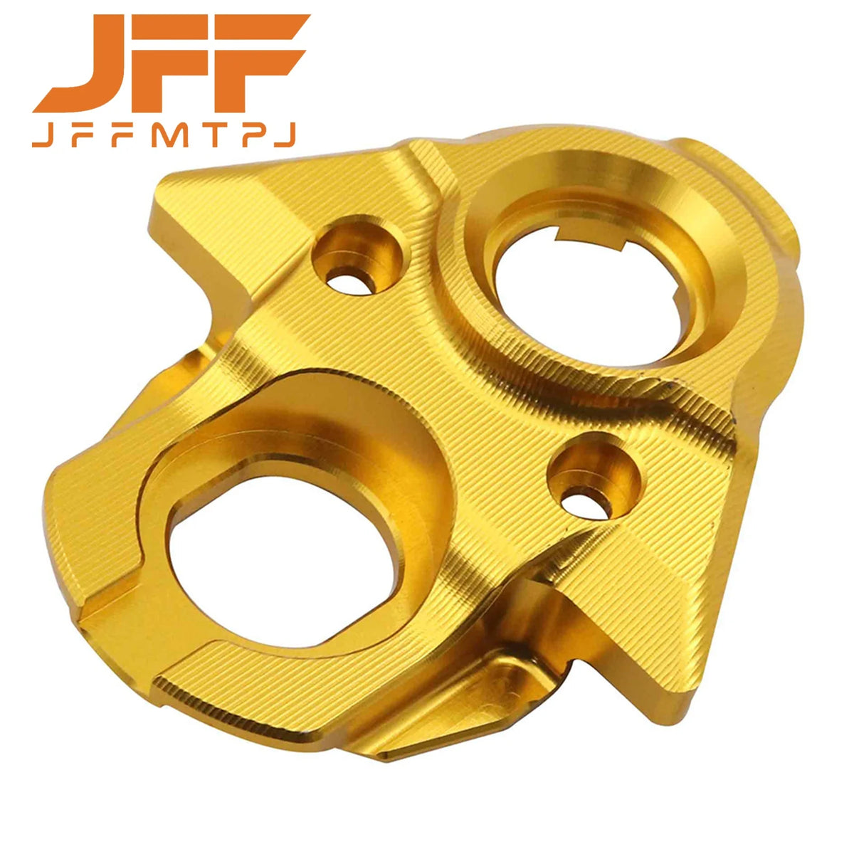 A brass-colored aluminum ignition switch cover for an electric dirt bike.