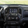Interior view of a vehicle's center console navigation panel trim cover for Chevy Silverado and GMC Sierra.