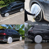 Two black SUVs are shown with white tire storage covers placed on the wheels.