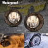 Close-up view of waterproof fog light assemblies for a Chevrolet Camaro, showing clear lenses and protective housing.
