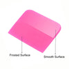 A pink anti-scratch PPF squeegee tool showing a frosted surface and a smooth surface.