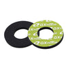 A pair of black and lime green gel rubber handlebar grips for dirt bikes.