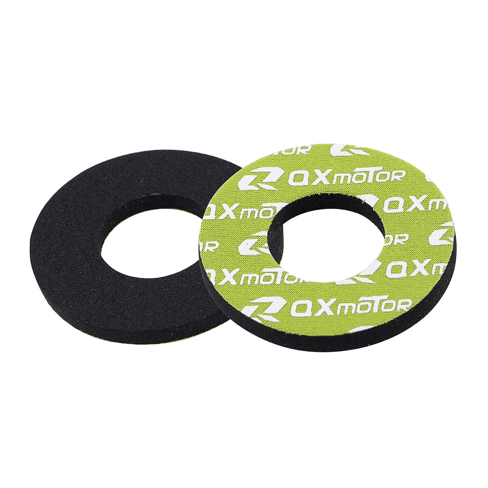 A pair of black and lime green gel rubber handlebar grips for dirt bikes.