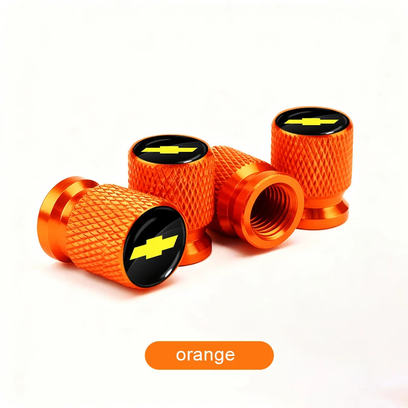 Orange durable aluminum tire valve covers with black and yellow accents