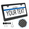A black carbon fiber license plate frame cover with a white background and blue accent stripe, shown with mounting hardware.