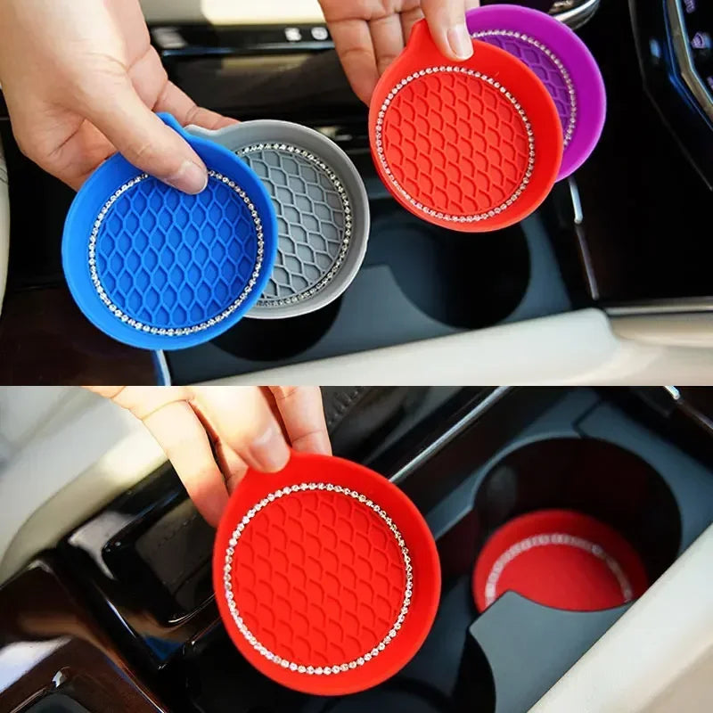 Hands hold colorful rhinestone car cup holder coasters in various colors and textures.