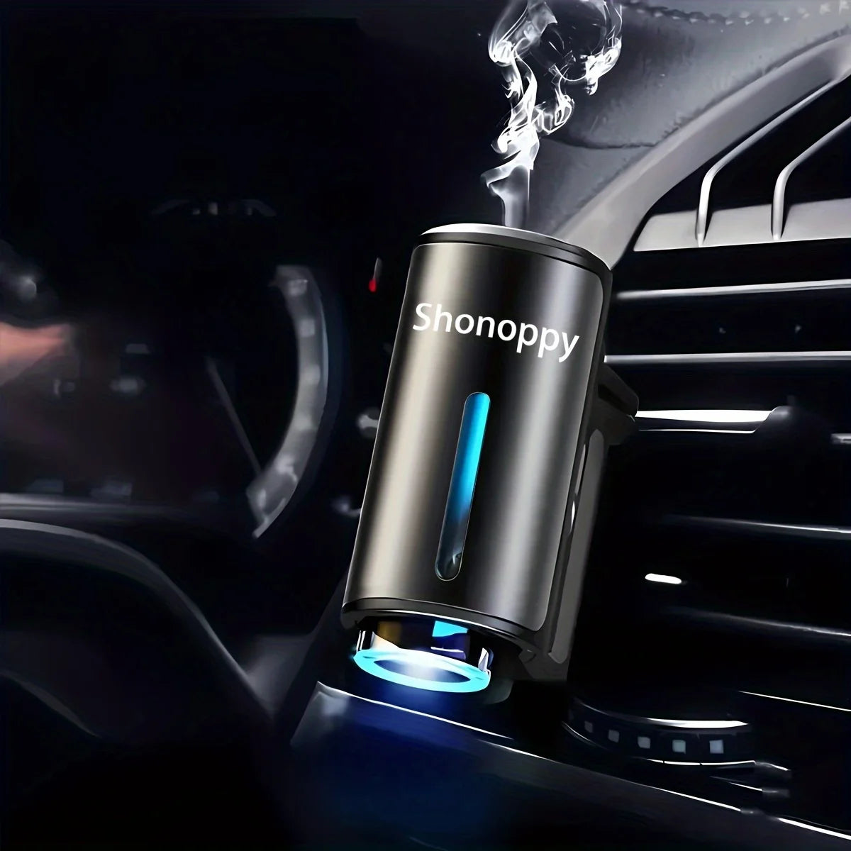 A close-up of a Shonoppy portable car air freshener emitting blue light and smoke inside a car vent.