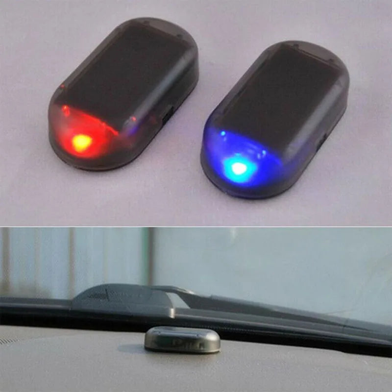 Two small electronic warning lights, one red and one blue, are shown against a white background.