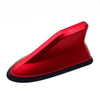 A red shark fin universal car antenna amplifier with a black base.