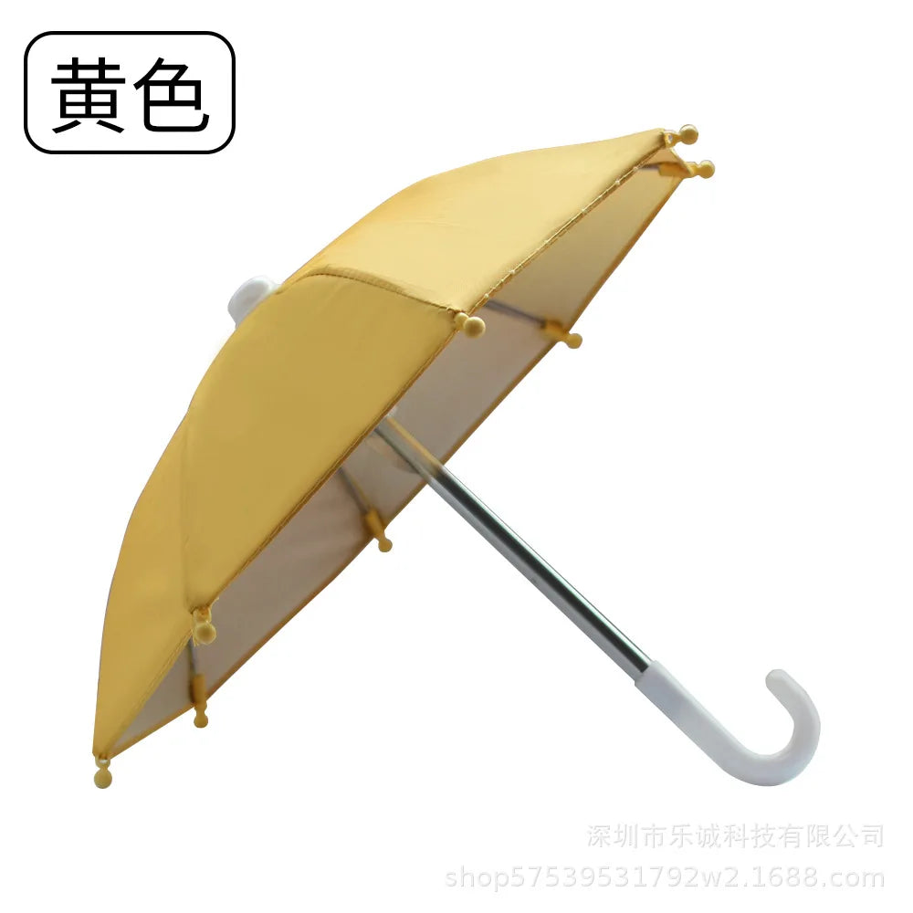 A yellow mini motorcycle sunshade umbrella shown in a daylight setting.