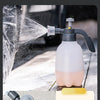 A hand pump automatic sprayer is shown dispensing water onto a surface, demonstrating its automatic water dispensing feature.