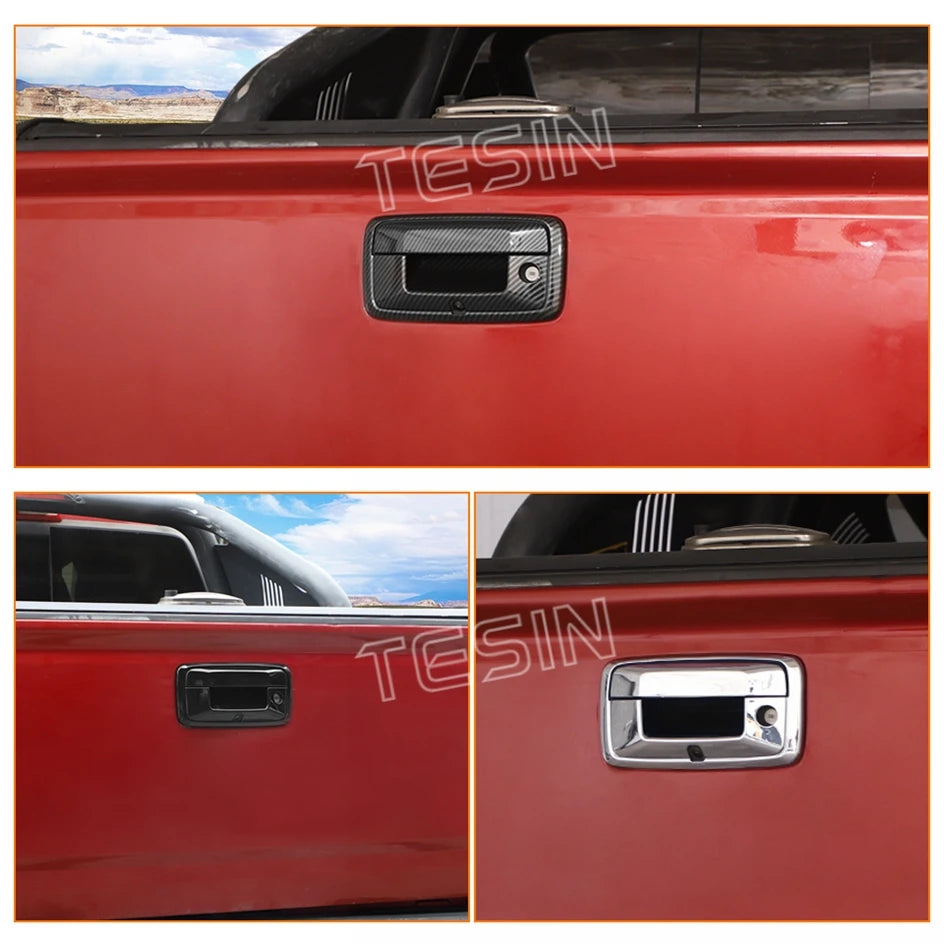Close-up view of a red truck tailgate with two different style handle trim covers.