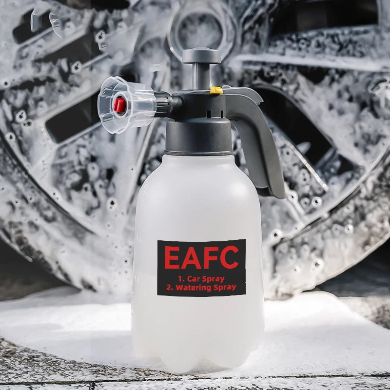 A white heavy duty hand pump foam sprayer bottle with a black pump and nozzle is shown on a snowy surface.