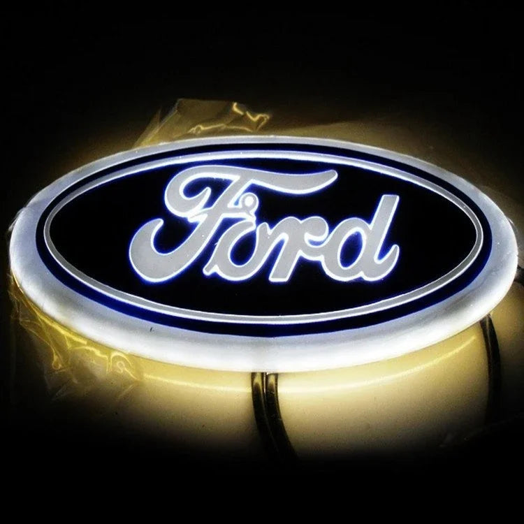 A round LED logo emblem featuring the word Ford in blue light on a black background.