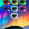 A vibrant neon heart solar energy decorative lamp is displayed against a background of the aurora borealis and a dark car.