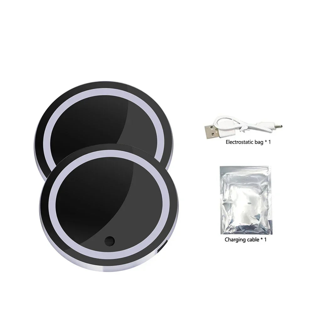 Two black and white LED car cup holder coasters with a charging cable and bag