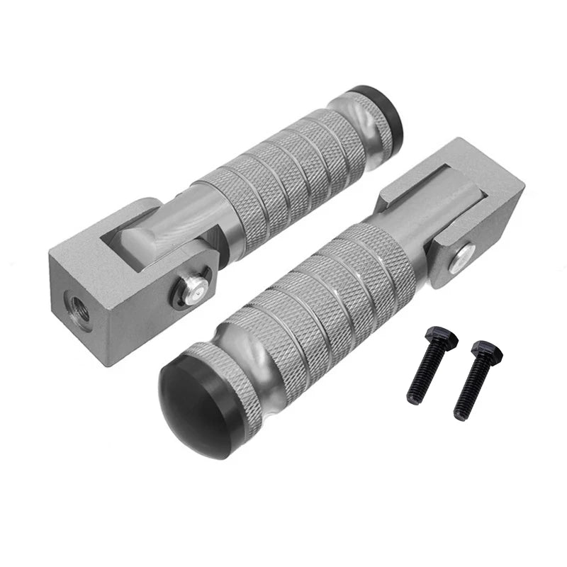 A pair of silver aluminum alloy foldable foot pegs with textured grips and mounting plates.