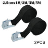 Two black heavy-duty cam buckle tie-down straps with silver alloy buckles.