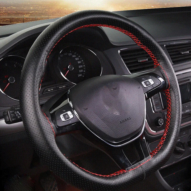A close-up view of a black steering wheel with red stitching, showing a DIY faux leather cover.