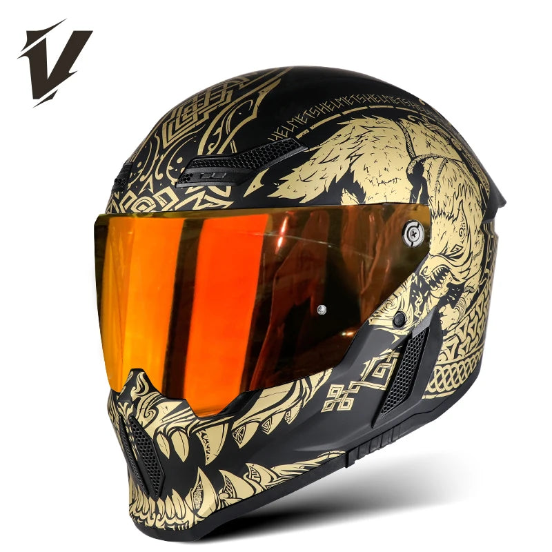 Casco de motocicleta negro con diseño gráfico dorado y negro y visera naranja.