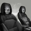 A pair of black universal car headrest covers shown in a close-up view.