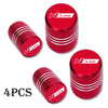 Set of four red aluminum tire valve caps with a textured finish and N Line branding