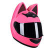 A bright pink cat-ear full face motorcycle helmet with a black visor.