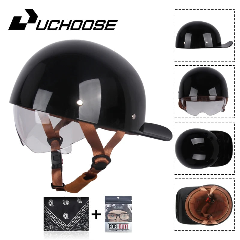 Black vintage open-face motorcycle helmet with clear visor and brown strap, shown with accessories.