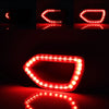 Red LED grill lights shaped like a switchback for a Dodge Charger, reflecting on a dark surface.