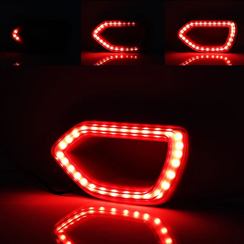 Red LED grill lights shaped like a switchback for a Dodge Charger, reflecting on a dark surface.