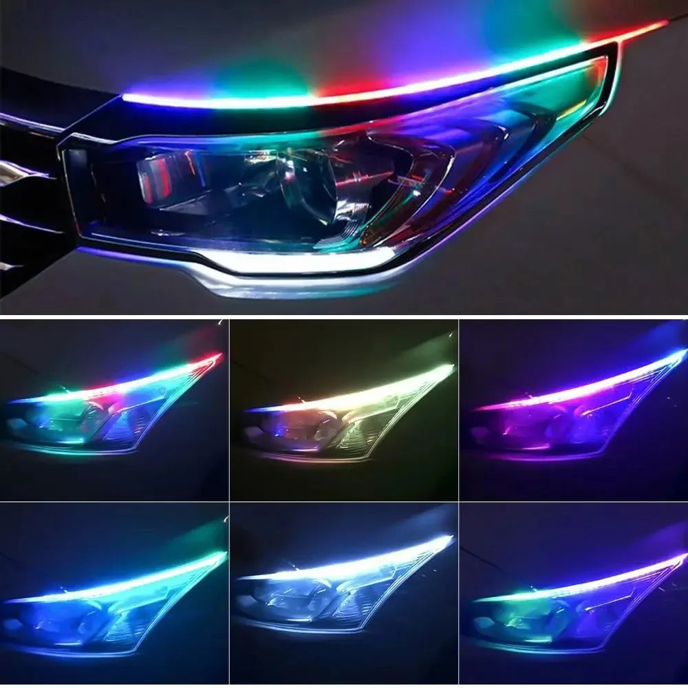 Close-up view of an automotive headlight with colorful RGB DRL LED light strips activated.