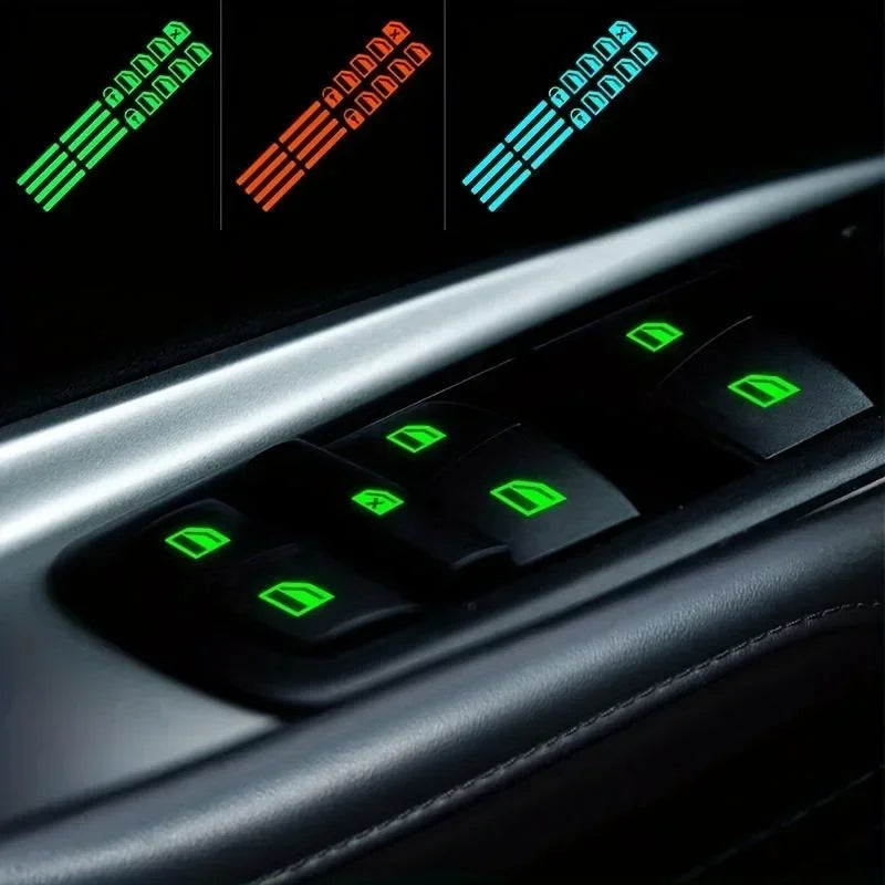 Close-up of a car window control panel showing various colored luminous button decals.