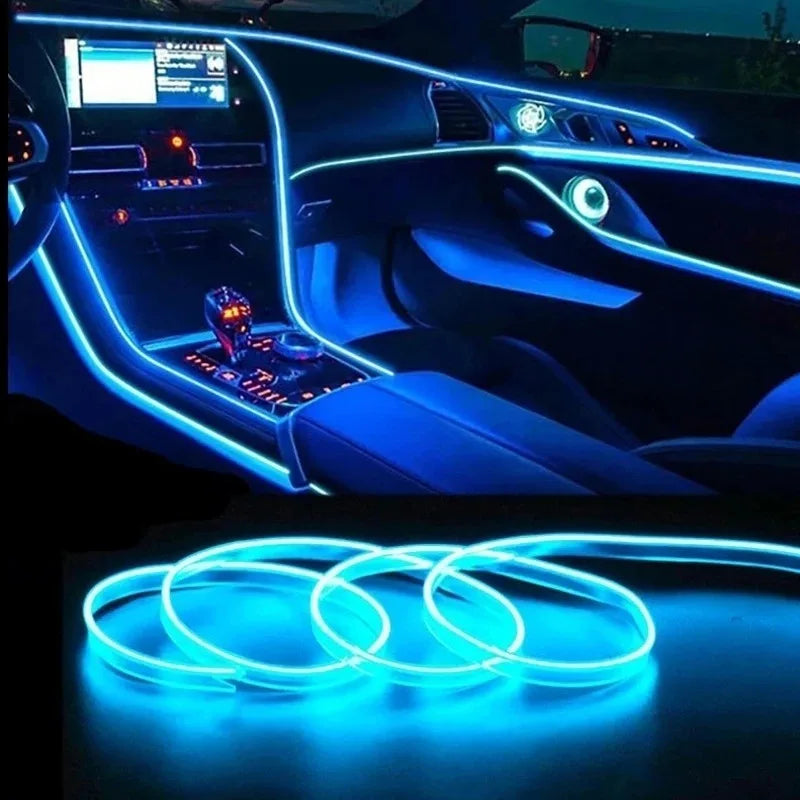 Flexible blue LED wire lights decorating the interior of a car dashboard and door panel.