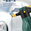 A green high-pressure electric foam spray bottle is shown spraying water onto a car tire in an outdoor setting.
