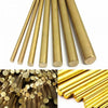 A close-up view of various brass round rods used for DIY craft and jewelry making.