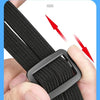 A close-up of a black heavy duty motorcycle seat strap kit being adjusted on a hand.