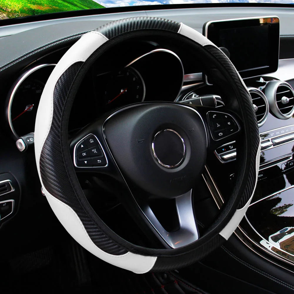 A black steering wheel with a white PU carbon fiber cover is visible inside a car's interior.
